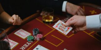 A group of people playing poker Description automatically generated